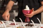 Man Topping Ice-cream With Gems And Jellies Stock Photo