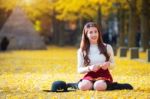 Beautiful Girl With Yellow Leaves In Nami Island, Korea. Nami Island In Autumn Stock Photo