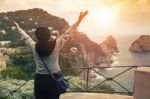 Tourist Woman Standing On Capri Island View Point Most Popular Traveling Destination In South Italy Stock Photo