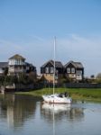 Faversham, Kent/uk - March 29 : Yacht Cruising Down The Swale To Stock Photo