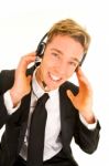 Businessman Adjusting Headset Stock Photo