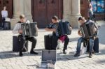 Three Men Playing Accordians In Krakow Stock Photo