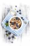 Bowl Of Muesli With Fresh Blueberries On White Wooden Table Stock Photo