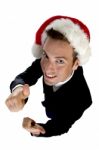 Caucasian Businessman With Cheerup And Santa Cap Stock Photo