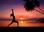 Silhouette Girl Doing Yoga Stock Photo