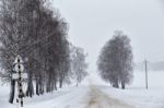 Snowfall And Sleet On Winter Road. Ice Snowy Road. Winter Snowst Stock Photo