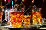 Jugs Of A Fruity Alcoholic Drink Awaiting Collection Stock Photo