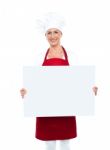 Female Chef Holding White Board Stock Photo