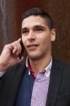 Portrait Of A Young Man With Talking On The Phone Stock Photo