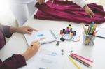 Two Young Women Working As Fashion Designers And Drawing Sketche Stock Photo