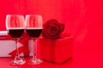 St Valentine's Setting With Present And Red Wine Stock Photo