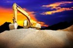 Excavator In Dusk Stock Photo