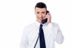 Young Professional Answering Phone Call Stock Photo