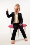 Little Girl In Black Suit Stock Photo