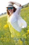 Beautiful Young Woman Enjoying Summer In A Field Stock Photo