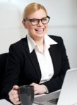 Beautiful Businesswoman Holding Coffee Cup Stock Photo