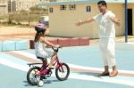 Girl Riding Bicycle Stock Photo