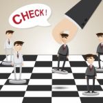 Cartoon Businessman In Chessboard Stock Photo