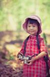 Asian Girl With Digital Camera In Beautiful Outdoor. Vintage Pic Stock Photo