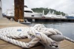 White Rope With Mooring Bollard Stock Photo