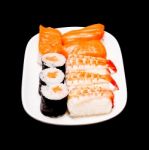 Sushi In White Plate On Black Background Stock Photo