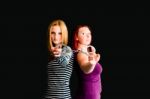 Two Young Women With Handcuffs Stock Photo