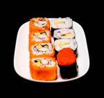 Sushi In White Plate On Black Background Stock Photo