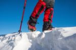 View Of Walking On Snow With Snow Shoes And Shoe Spikes In Winte Stock Photo