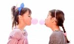 Portraits Of Beautiful Little Girls Blowing Bubbles Stock Photo