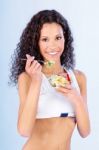 Woman Have Salad On Fork Stock Photo