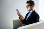 Handsome Young Man Working With Digital Tablet In The Office Stock Photo