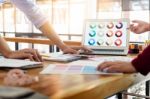 Two Young Men Working As Fashion Designers And Drawing Sketches Stock Photo