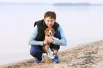 Beagle Dog With Its Owner Stock Photo