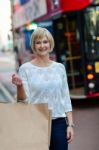 Trendy Woman Holding Shopping Bag Stock Photo