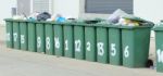 Row Of Large Green Bins Stock Photo