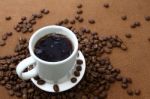 White Coffee Cup And Coffee Beans Stock Photo