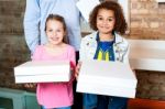 Kids Holding Pizza Boxes Stock Photo