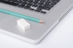 Pencil And Eraser On The Laptop Stock Photo