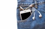 White Smartphone In Your Pocket Blue Jeans With Earphone And Usb Cable For Transfer Data Or Information On Isolated Background Stock Photo