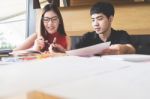 Brother Helps Her Sister To Do Their Homework Stock Photo