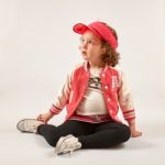 Little Girl Fashion Model With Red Cap Stock Photo