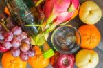 Glass And Many Fruits Stock Photo