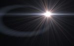 Digital Lens Flare In Black Background Horizontal Frame Warm Stock Photo