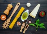 The  Pasta On Black Wooden Background. Yellow Italian Pasta With Stock Photo