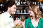 Couples Enjoying Drinks In Nightclub Stock Photo