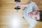 Man Lifting Dumbbell In Gym Stock Photo