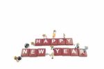 Miniature Worker Team Building Word Happy New Year On White Back Stock Photo