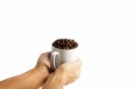 White Cup With Coffee Beans Isolated Stock Photo