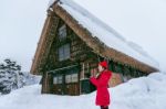 Young Woman In Shirakawa-go Village In Winter, Unesco World Heritage Sites, Japan Stock Photo