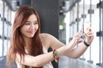 Portrait Of Thai Adult Beautiful Girl Using Her Smart Phone Selfie Stock Photo